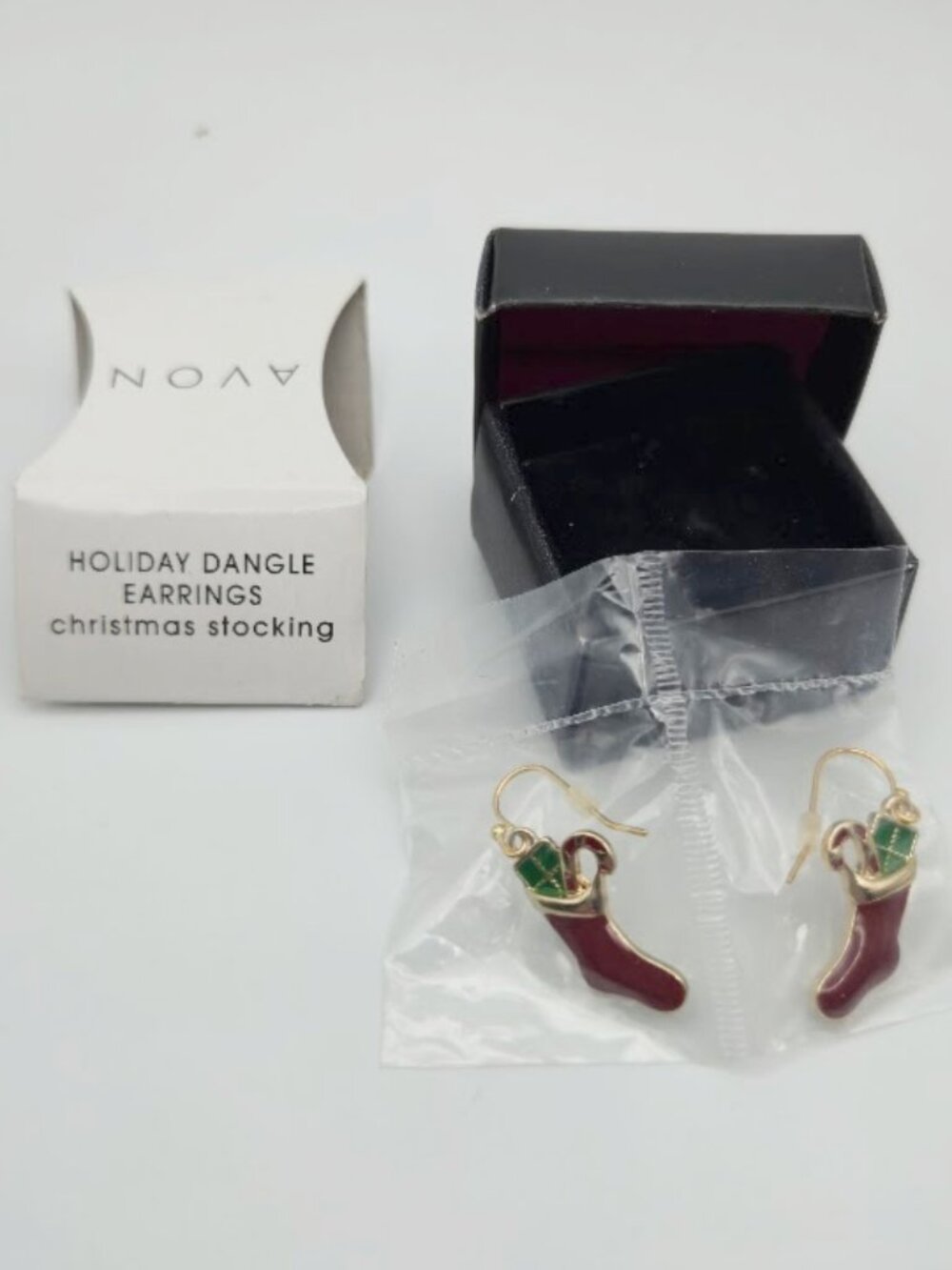 New / Sealed in box AVON vintage 2012 Christmas stocking  / candy cane earrings